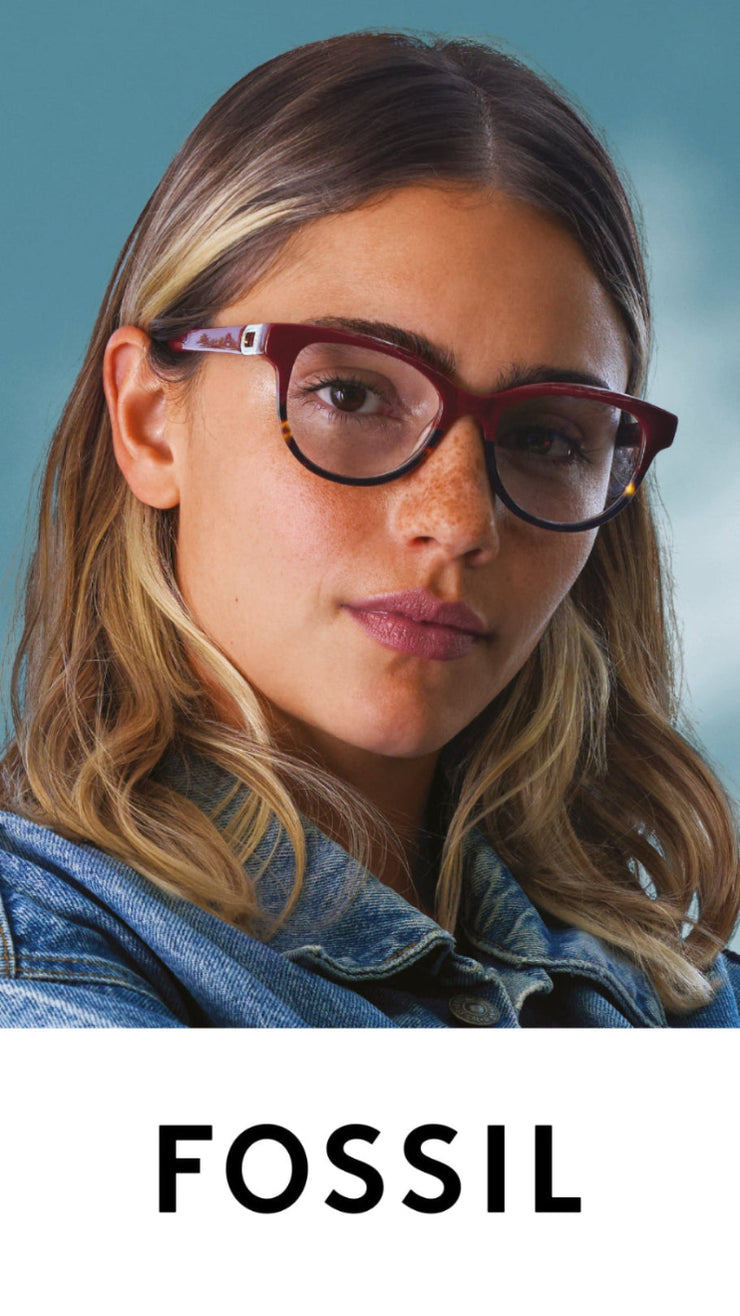 Person wearing glasses with a blurred background and &#39;Fossil&#39; branding.